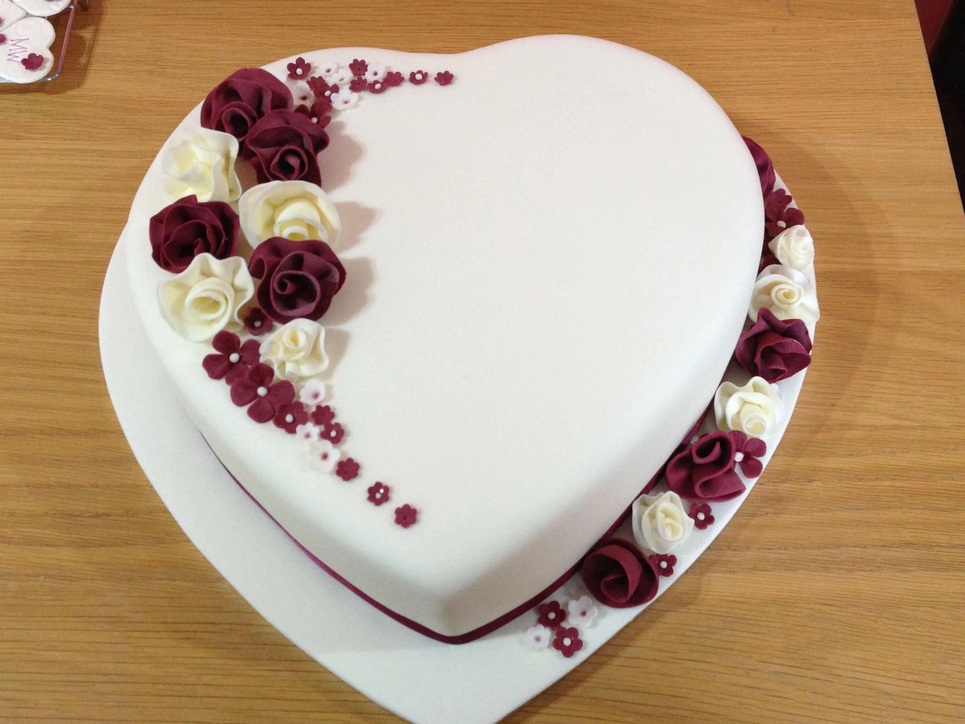 Heart shaped wedding cake with whimsical flowers | Birthday cake ...