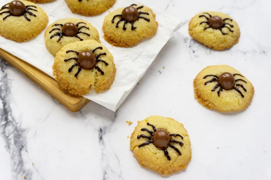 cookies with chocolate spider decorations on them