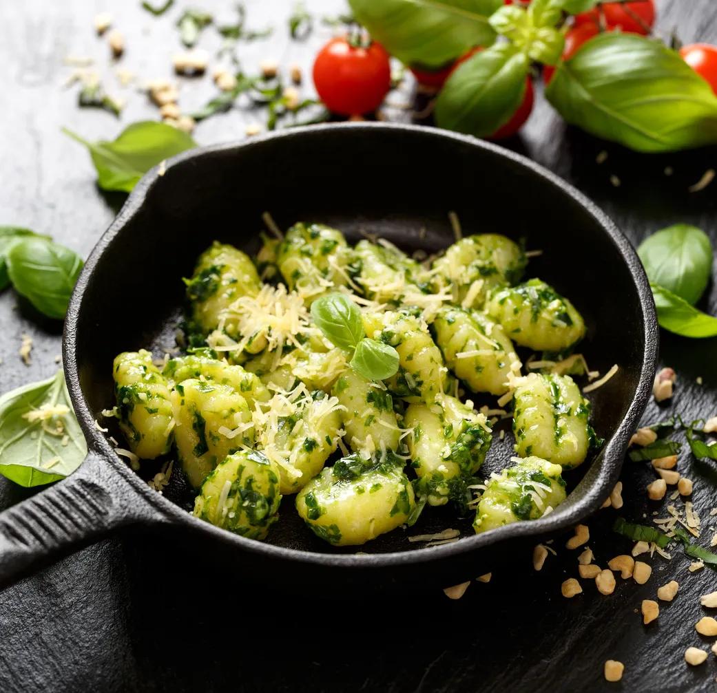 Gnocchi with herb pesto, delicious Italian vegetarian dish - Nuttelex
