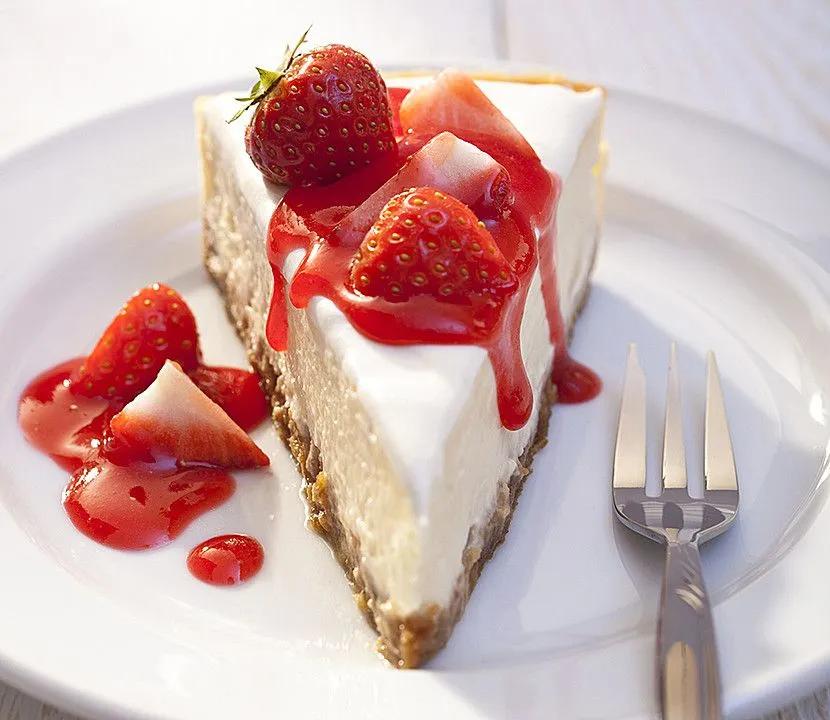 a piece of cheesecake with strawberries on top