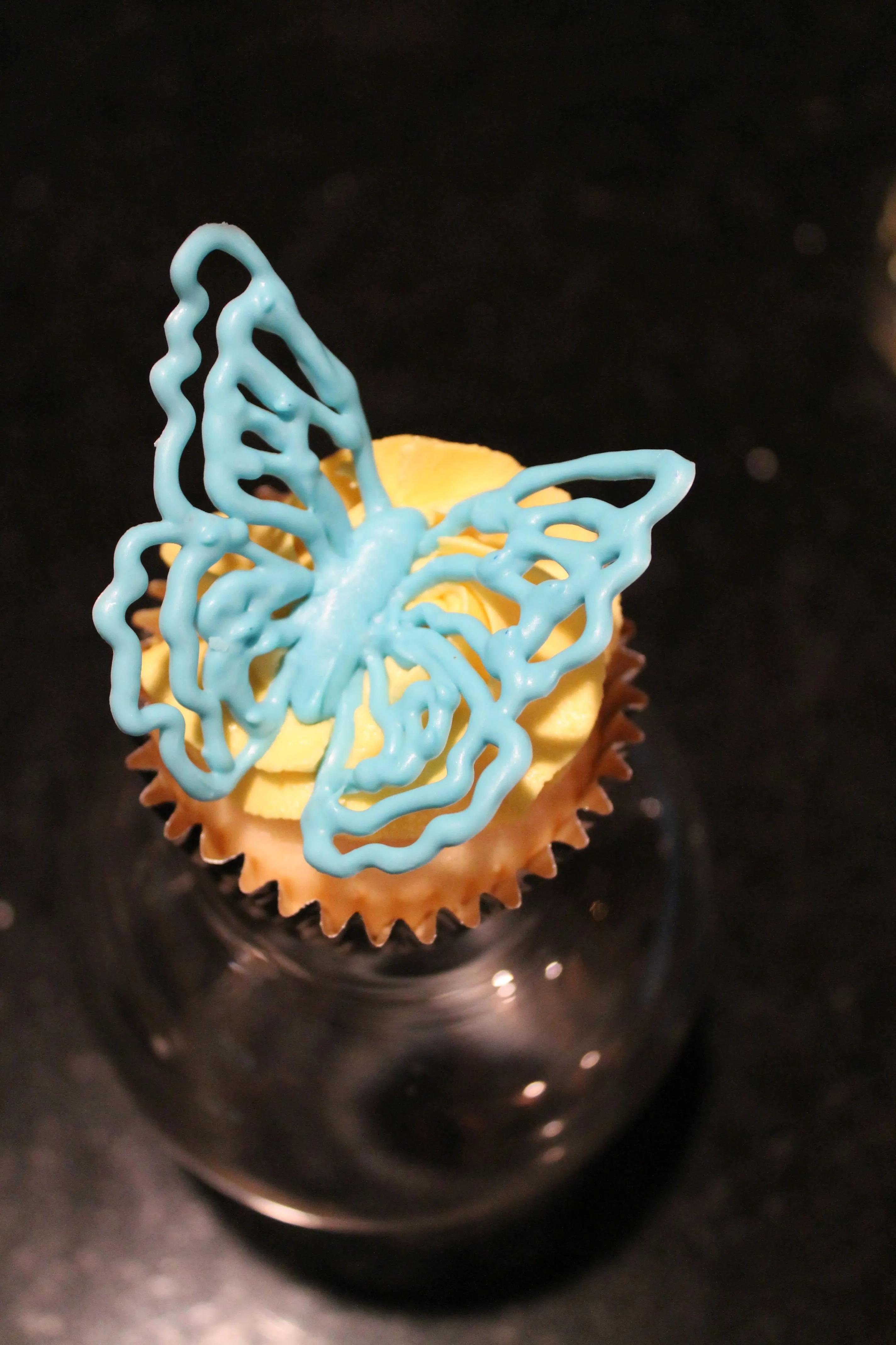 Blue Chocolate Butterfly Cupcake | Chocolate butterflies, Butterfly ...