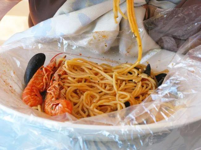 A starter of Spaghetti al Cartoccio with seafood served at Osteria del ...