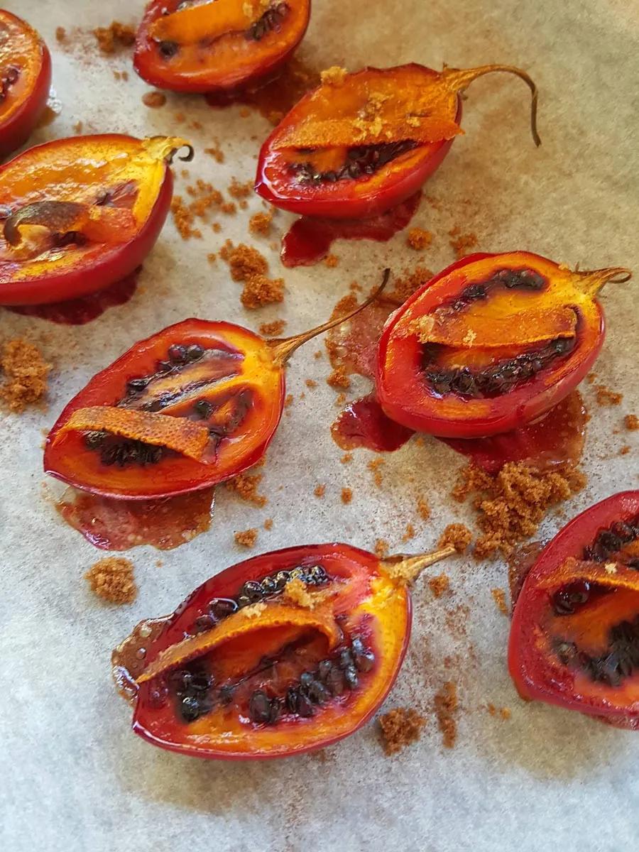 Tamarillos baked with a sprinkle of cinnamon and dusting of brown sugar.