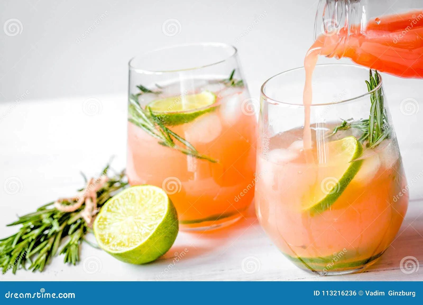 Fitness Cocktail In Glass With Lime And Rosemary On White Table Stock ...