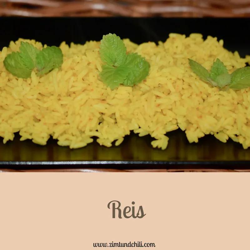 rice with mint leaves on top in a black plate and the words reis above it