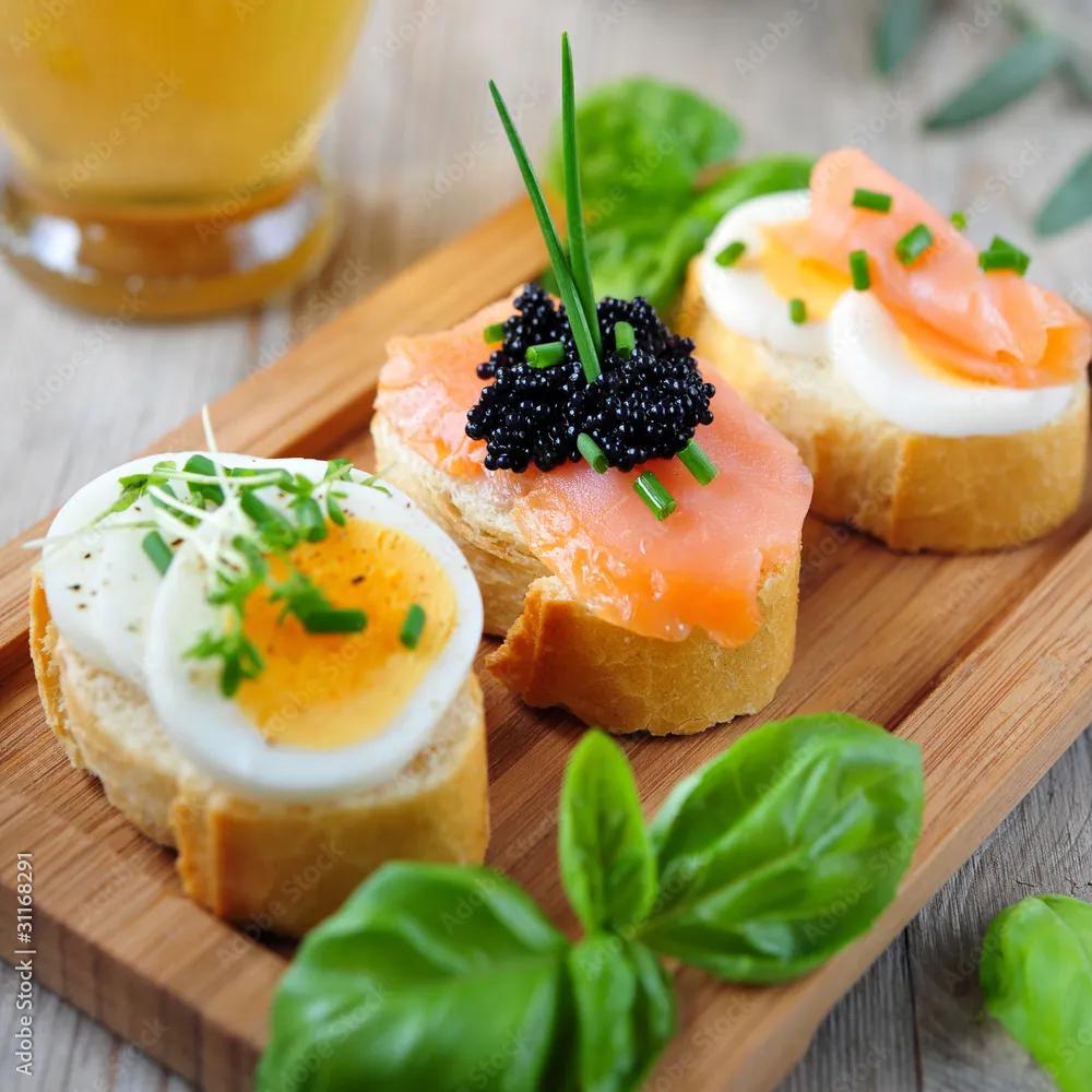 canapes mit ei, lachs und kaviar Stock-Foto | Adobe Stock