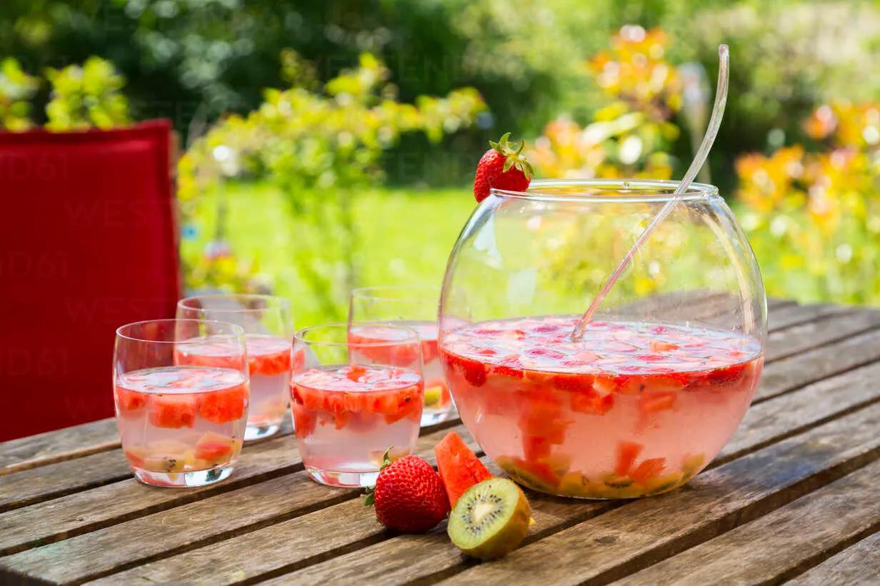 Watermelon strawberry kiwi bowle in garden stock photo