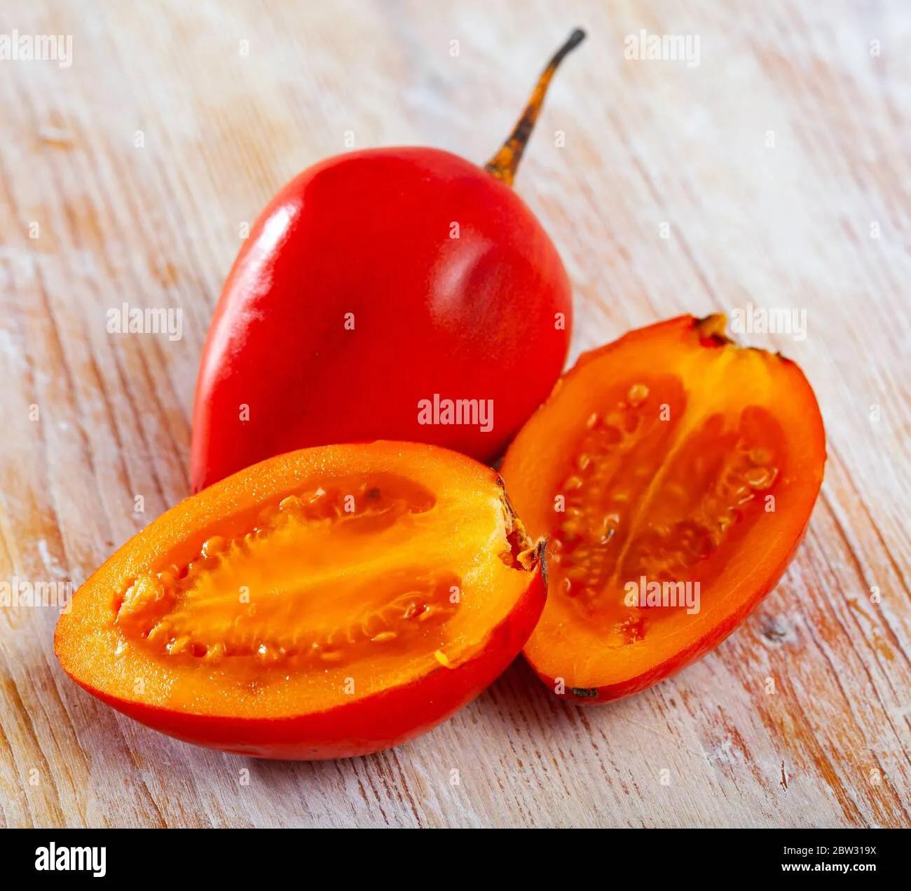 Exotic tropical tamarillo fruit on wooden table. Vitamin fruits Stock ...