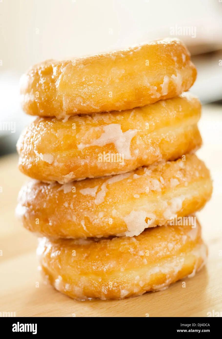 Pile of doughnuts / donuts Stock Photo - Alamy