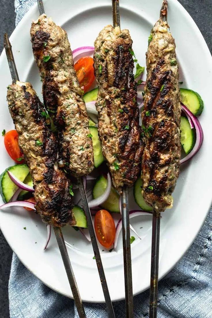 Grilled lamb kofta made with onion and spices and then shaped and ...