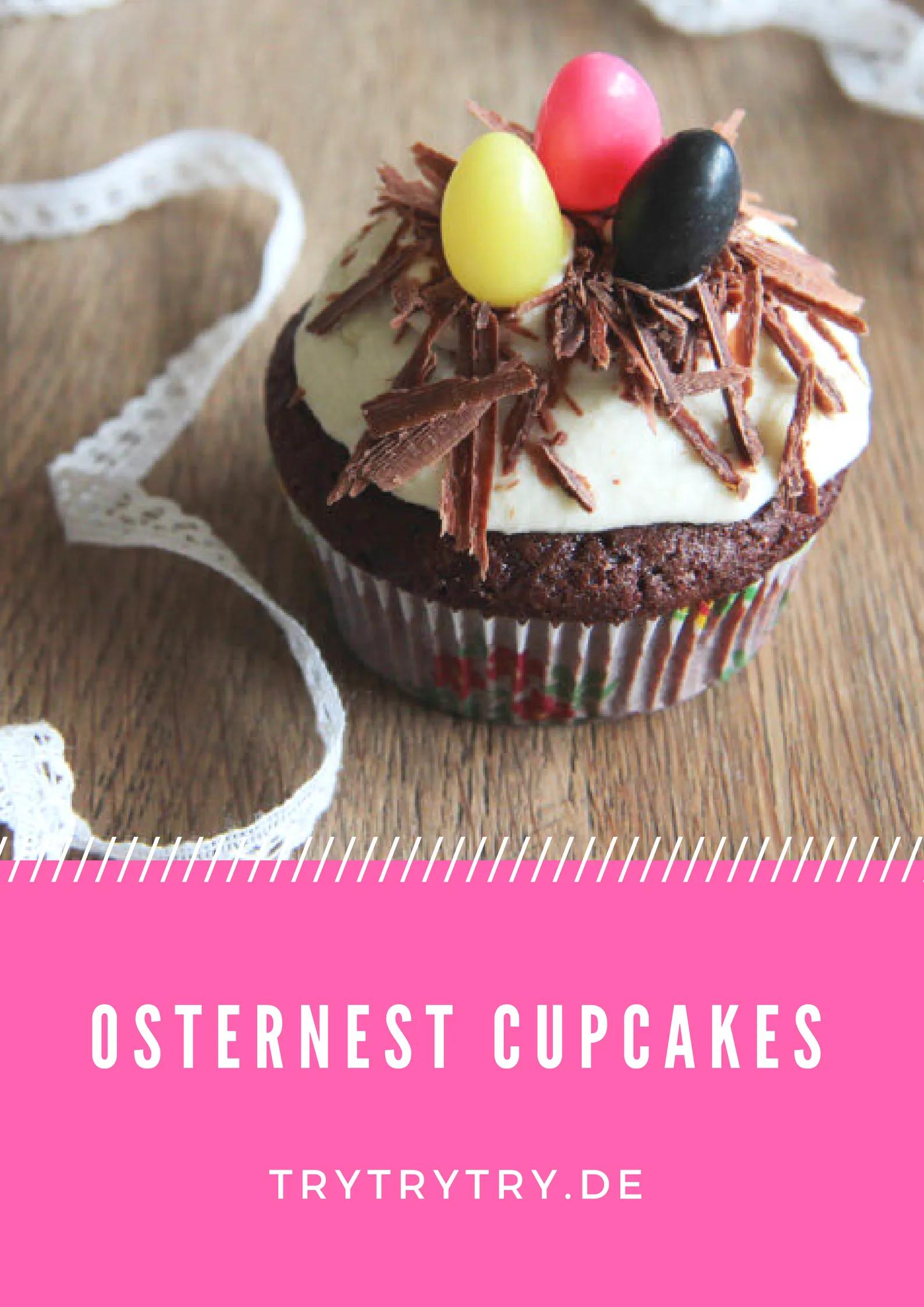 a cupcake with white frosting and chocolate eggs on top is sitting on a ...